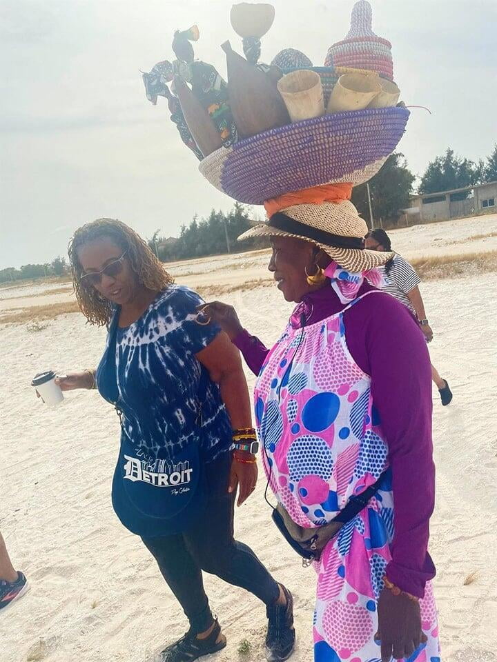 photo of a group of women all wearing gold shirts that say sisters